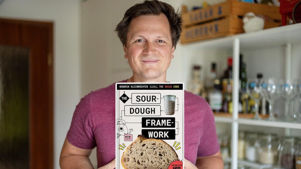 Hendrik holding The Sourdough Framework book